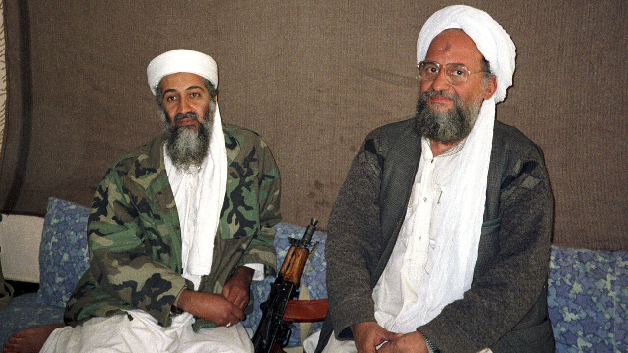 BINLADEN/ Osama bin Laden (L) sits with his adviser and purported successor Ayman al-Zawahri, an Egyptian linked to the al Qaeda network, during an interview with Pakistani journalist Hamid Mir (not pictured) in an image supplied by the respected Dawn newspaper November 10, 2001. Al Qaeda's elusive leader Osama bin Laden was killed in a mansion outside the Pakistani capital Islamabad, U.S. President Barack Obama said on May 1, 2011. REUTERS/Hamid Mir/Editor/Ausaf Newspaper for Daily Dawn (AFGHANISTAN - Tags: POLITI