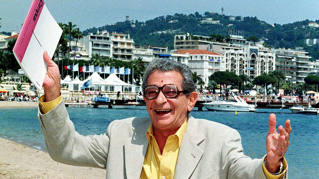 FRANCE FESTIVAL Egyptian director Youssef Chahine poses on the beach as the 51st Cannes Film Festival continues May 20. Chahine, who has participated five times with official entries in Cannes, attends this year's festival to give a lecture on cinematography.
JES/EB - RP1DRIEPXAAB