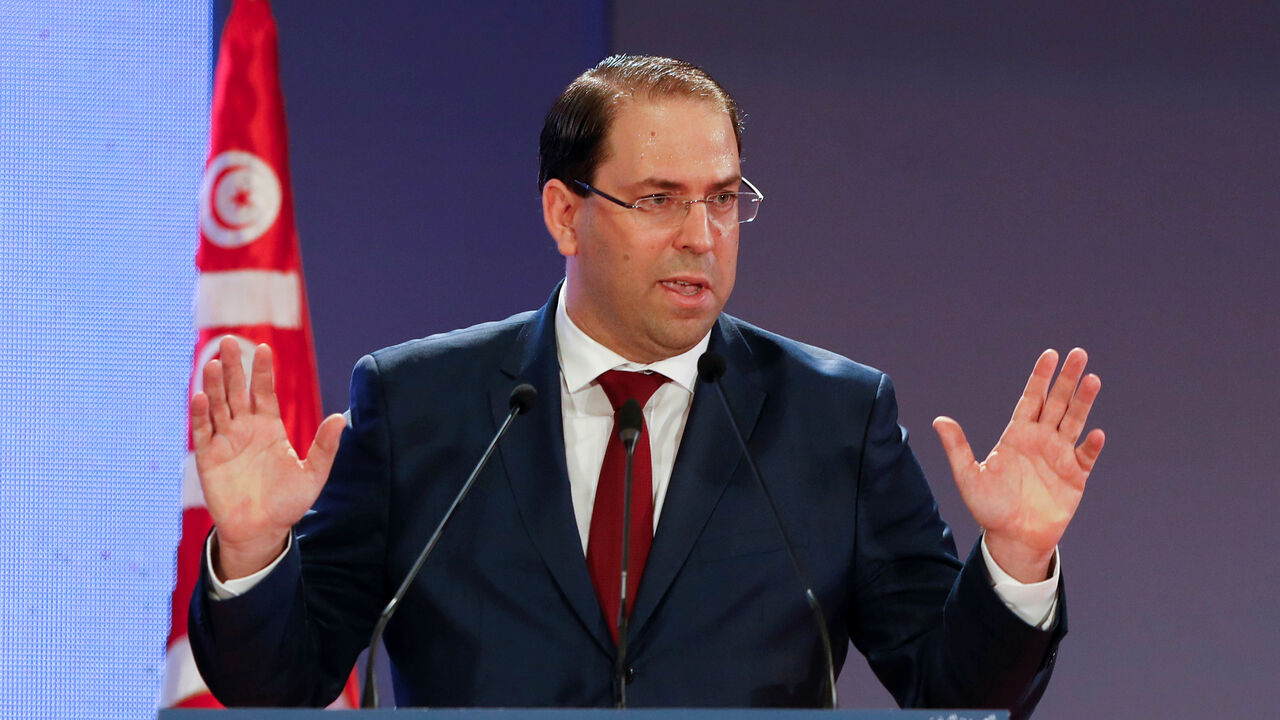 TUNISIA-ECONOMY/ Tunisia's Prime Minister Youssef Chahed gestures as he speaks during a national conference over 2019 budget in Tunis, Tunisia, September 14, 2018. REUTERS/Zoubeir Souissi - RC1171513940