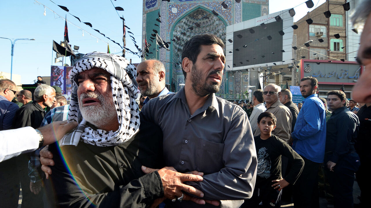 Men mourn during a funeral of the victims of assault that killed 25 people, in the streets of the southwestern Iranian city of Ahvaz Men mourn during a funeral of the victims of assault that killed 25 people, in the streets of the southwestern Iranian city of Ahvaz, Iran September 24, 2018. Tasnim News Agency/via REUTERS ATTENTION EDITORS - THIS PICTURE WAS PROVIDED BY A THIRD PARTY. - RC1503357B50