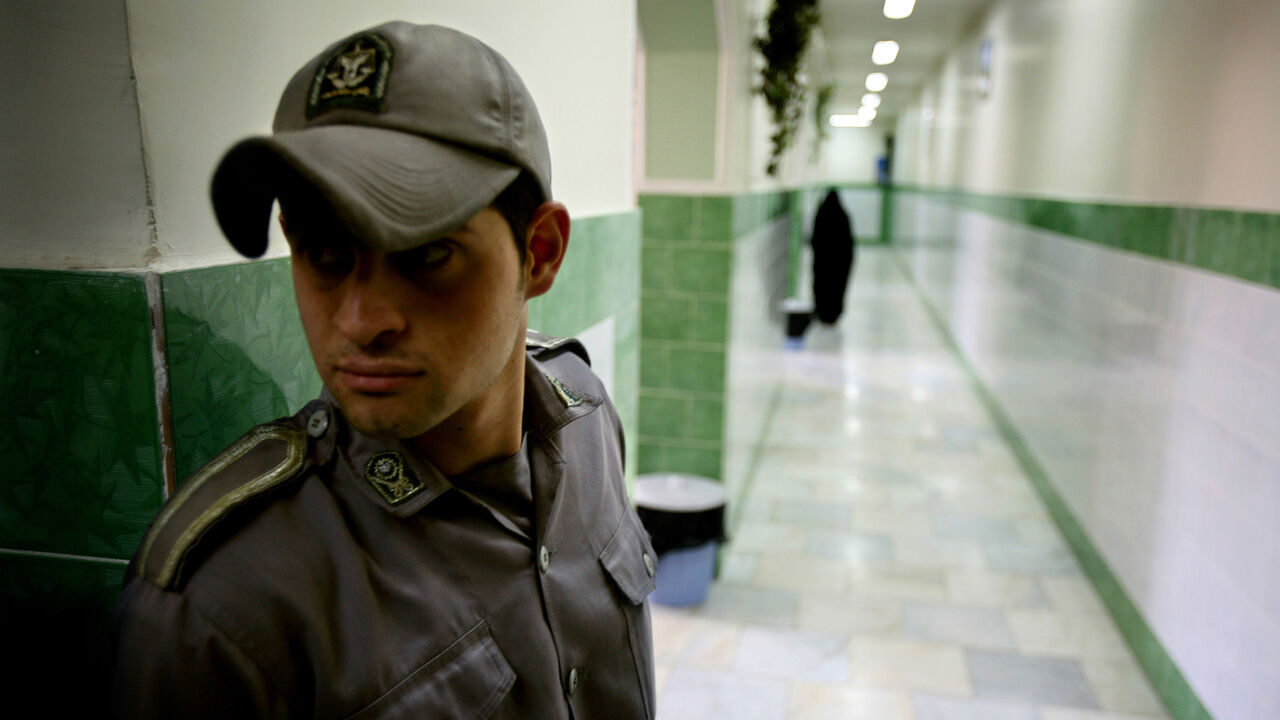 IRAN A prison guard stands along a corridor in Tehran's Evin prison June 13, 2006. Iranian police detained 70 people at a demonstration in favour of women's rights, the judiciary said on Tuesday, adding it was ready to review reports that the police had beaten some demonstrators. - PBEAHUNMBAM