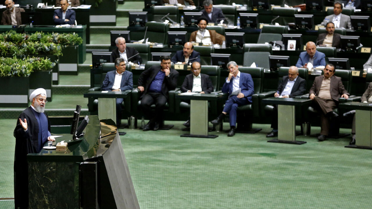 AFP_18N6GM President Hassan Rouhani speaks at the Iranian Parliament in the capital Tehran, on August 28, 2018. - It was the first time Rouhani had been summoned by parliament in his five years in power, with MPs demanding answers on unemployment, rising prices and the collapsing value of the rial, which has lost more than half its value since April. (Photo by ATTA KENARE / AFP) (Photo credit should read ATTA KENARE/AFP/Getty Images)