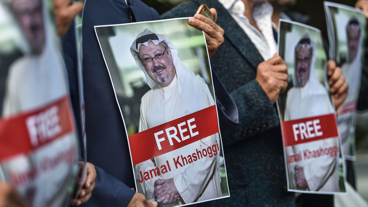 AFP_19S6CR TOPSHOT - Protestors hold pictures of missing journalist Jamal Khashoggi during a demonstration in front of the Saudi Arabian consulate in Istanbul on October 5, 2018. - Jamal Khashoggi, a veteran Saudi journalist who has been critical towards the Saudi government has gone missing after visiting the kingdom's consulate in Istanbul on October 2, 2018, the Washington Post reported. (Photo by OZAN KOSE / AFP) (Photo credit should read OZAN KOSE/AFP/Getty Images)