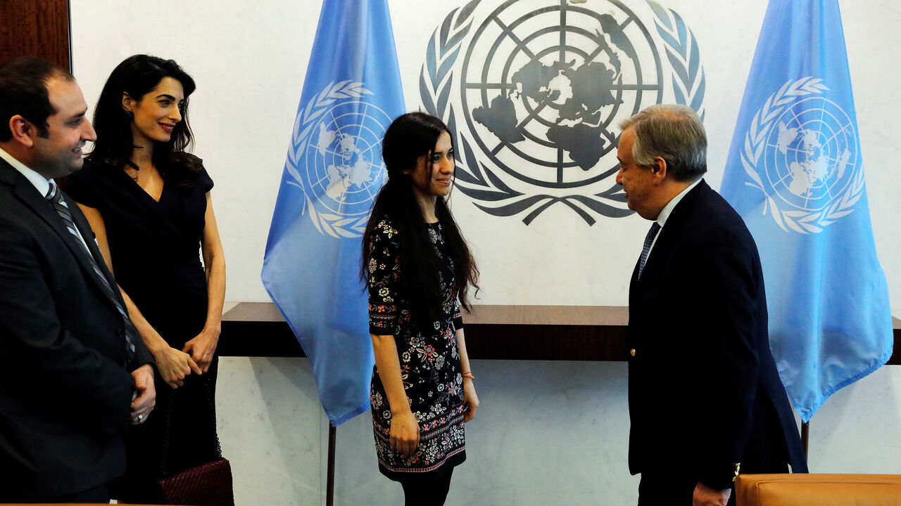 MIDEAST-CRISIS/IRAQ-CLOONEY International human rights lawyer Amal Clooney arrives with Yazidi survivor Nadia Murad (C) to meet with United Nations Secretary General, Antonio Guterres, at U.N. headquarters in New York, U.S., March 10, 2017. REUTERS/Lucas Jackson - RC19B328B270