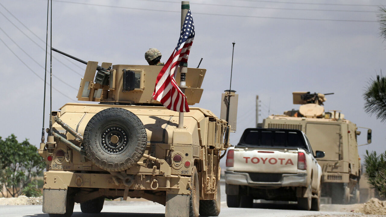 MIDEAST-CRISIS/SYRIA The U.S. flag flutters on a military vehicle in Manbej countryside, Syria May 12, 2018. REUTERS/Aboud Hamam - RC1B2D4114E0