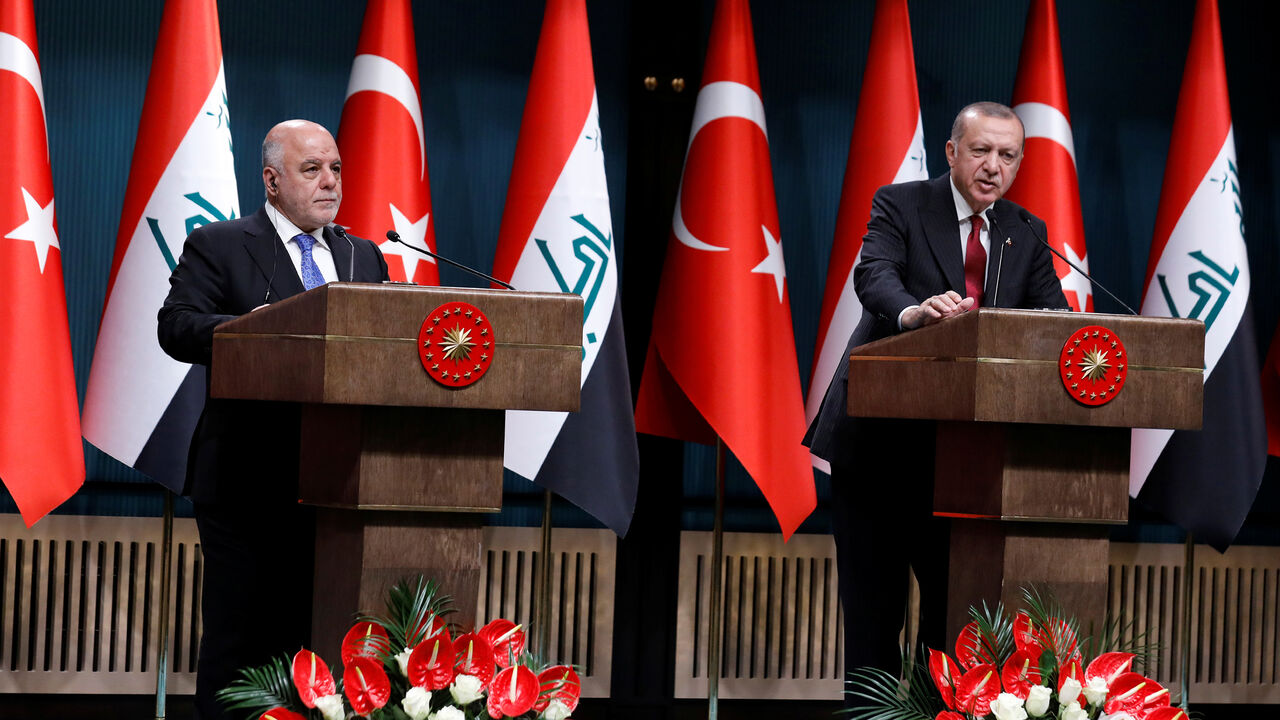 TURKEY-IRAQ/ Turkish President Tayyip Erdogan and Iraqi Prime Minister Haider al-Abadi attend a news conference in Ankara, Turkey, August 14, 2018. REUTERS/Umit Bektas - RC1274635EE0