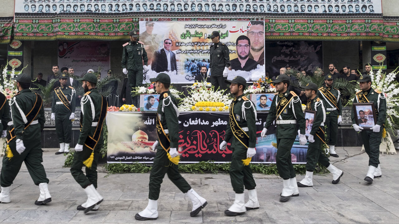 MIDEAST-CRISIS/SYRIA-IRAN Iranian soldiers walk past coffins of two member of Iranian Revolutionary Guards who were killed in Syria, during their funeral in Tehran October 28, 2015. REUTERS/Raheb Homavandi/TIMA ATTENTION EDITORS - THIS IMAGE WAS PROVIDED BY A THIRD PARTY. FOR EDITORIAL USE ONLY. - GF20000036090