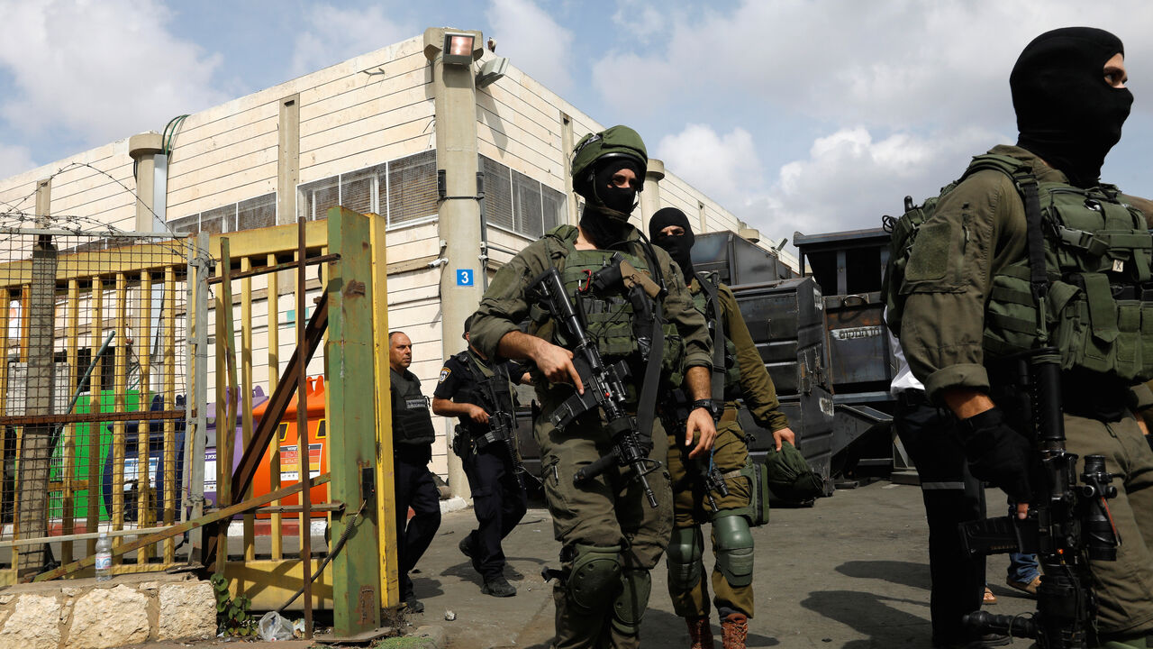 ISRAEL-PALESTINIANS/SHOOTING Israeli soldiers patrol near the scene where, according to Israeli media, a Palestinian shot and wounded three Israelis, at an industrial park adjacent to a Jewish settlement in the occupied West Bank October 7, 2018. REUTERS/Ronen Zvulun - RC156539A780