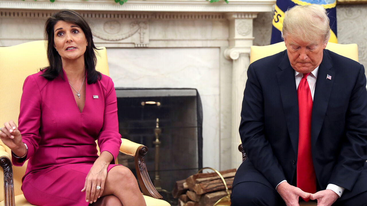 USA-TRUMP/HALEY Outgoing U.S. Ambassador to the United Nations Nikki Haley talks with U.S. President Donald Trump in the Oval Office of the White House after the president accepted Haley's resignation in Washington, U.S., October 9, 2018. REUTERS/Jonathan Ernst - RC1DE84AD970