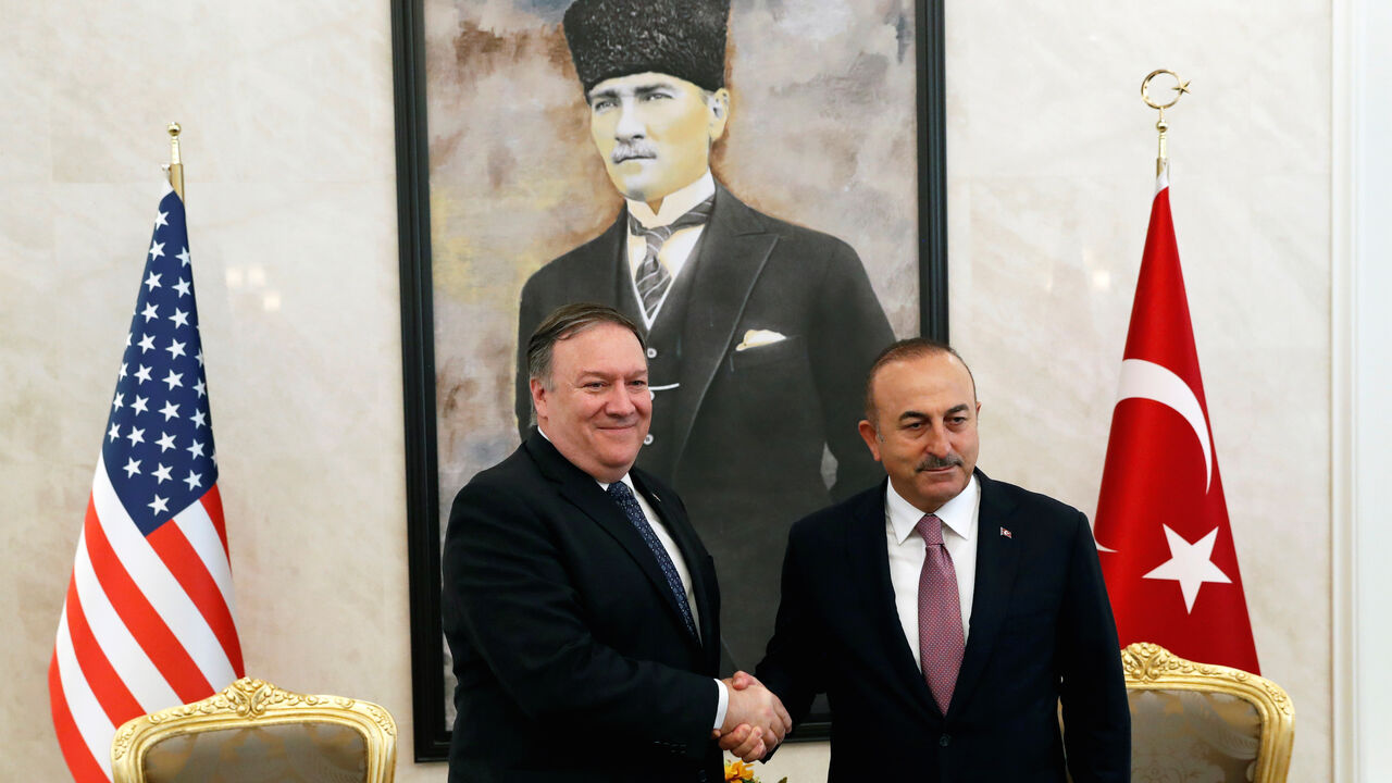 SAUDI-POLITICS/DISSIDENT-POMPEO U.S. Secretary of State Mike Pompeo greets Turkish Foreign Minister Mevlut Cavusoglu before their meeting in Ankara, Turkey, October 17, 2018. REUTERS/Leah Millis/Pool - RC155B9647D0