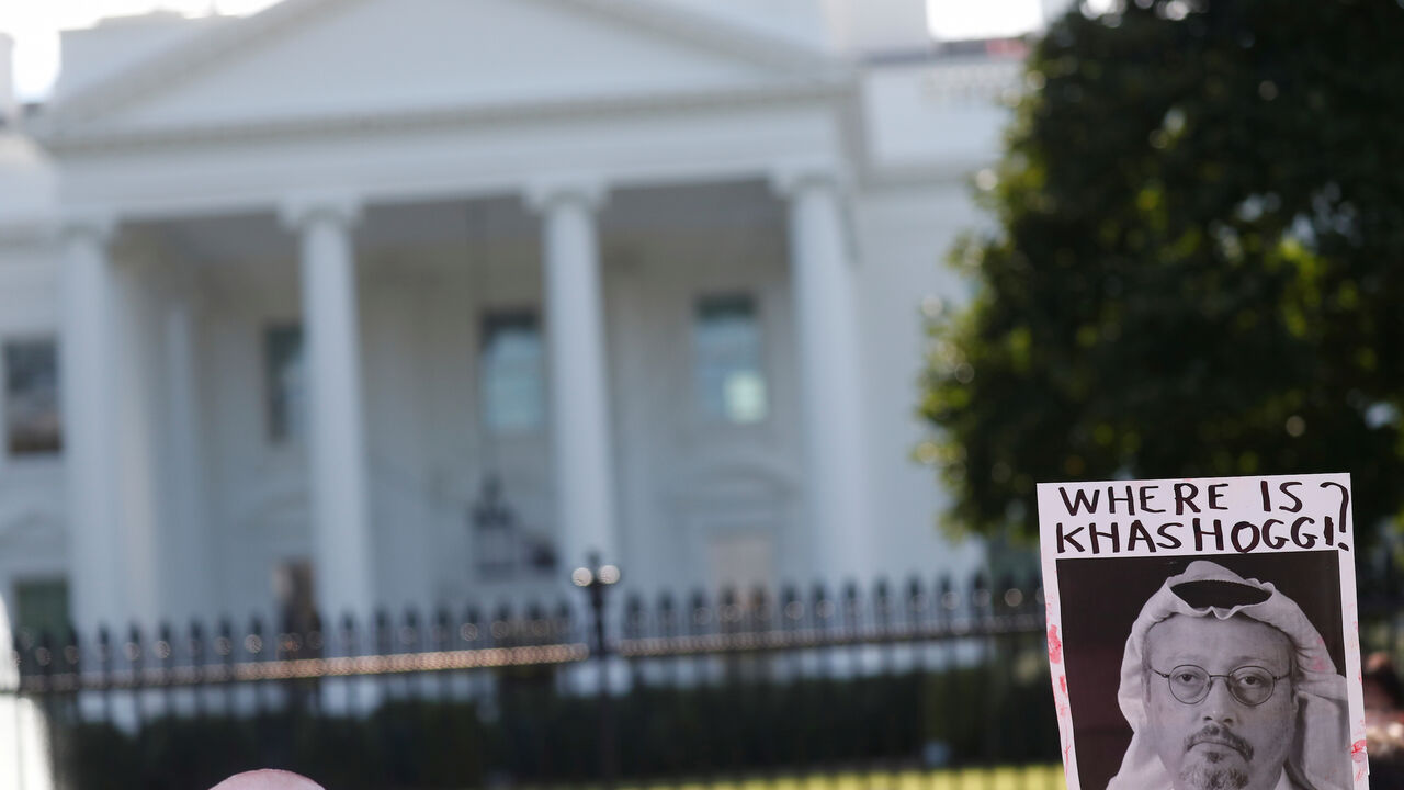 SAUDI-POLITICS/DISSIDENT-PROTEST An activist holds an image of missing Saudi journalist Jamal Khashoggi during a demonstration calling for sanctions against Saudi Arabia and to protest Khashoggi's disappearance, outside the White House in Washington, U.S., October 19, 2018. REUTERS/Leah Millis - RC1F626030D0