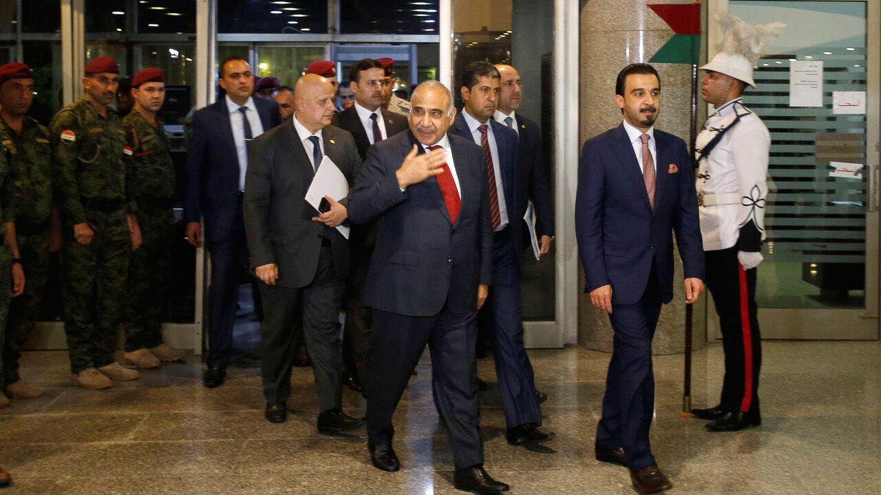 IRAQ-POLITICS/ Iraq's Prime Minister-designate Adel Abdul Mahdi and the speaker of Iraq's parliament Mohammed al-Halbousi arrive at the parliament building in Baghdad, Iraq, October 24, 2018. REUTERS/Khalid al Mousily - RC1D24E3EB30