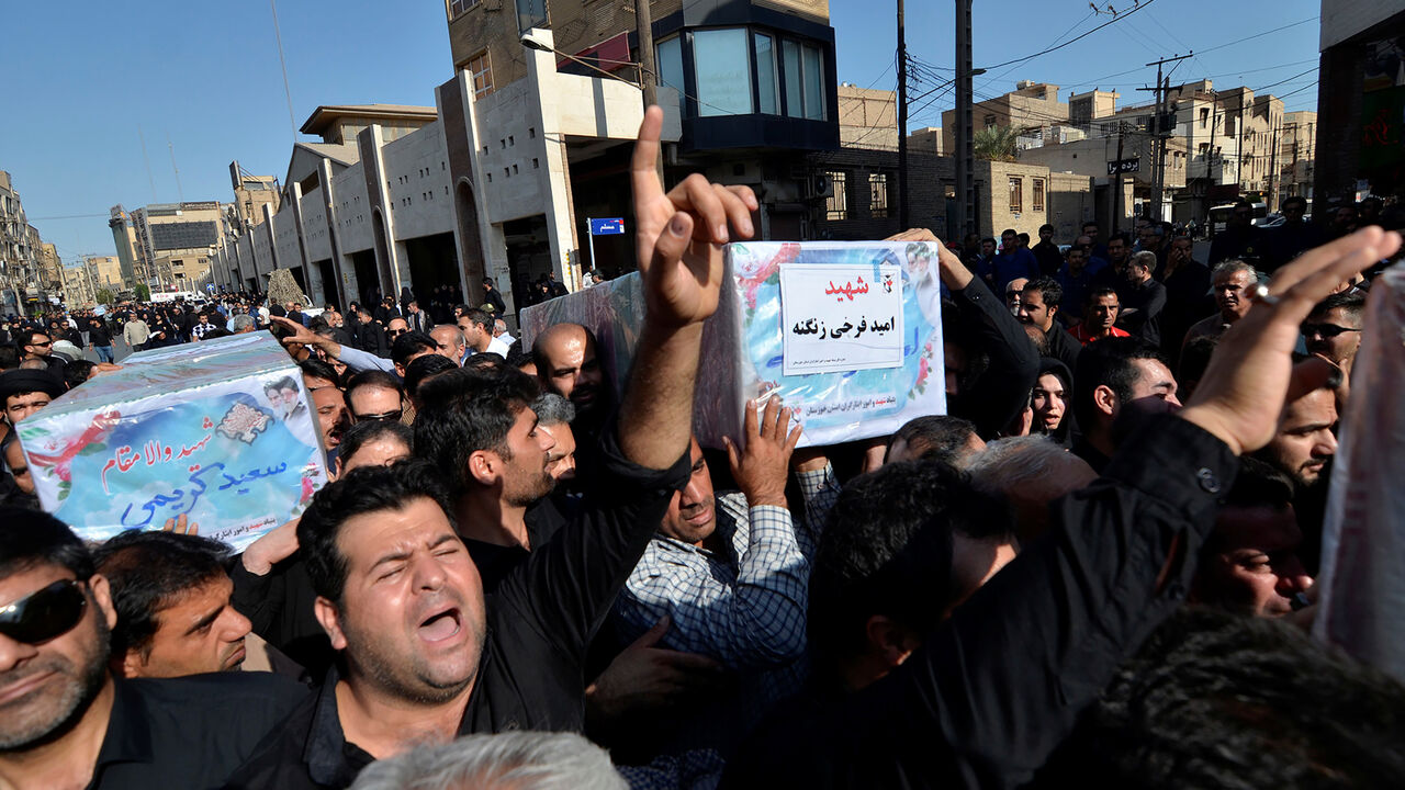 IRAN-MILITARY/ATTACKS People carry coffins during a funeral of the victims of assault that killed 25 people, in the streets of the southwestern Iranian city of Ahvaz, Iran September 24, 2018. Tasnim News Agency/via REUTERS ATTENTION EDITORS - THIS PICTURE WAS PROVIDED BY A THIRD PARTY. - RC18F3BB4390