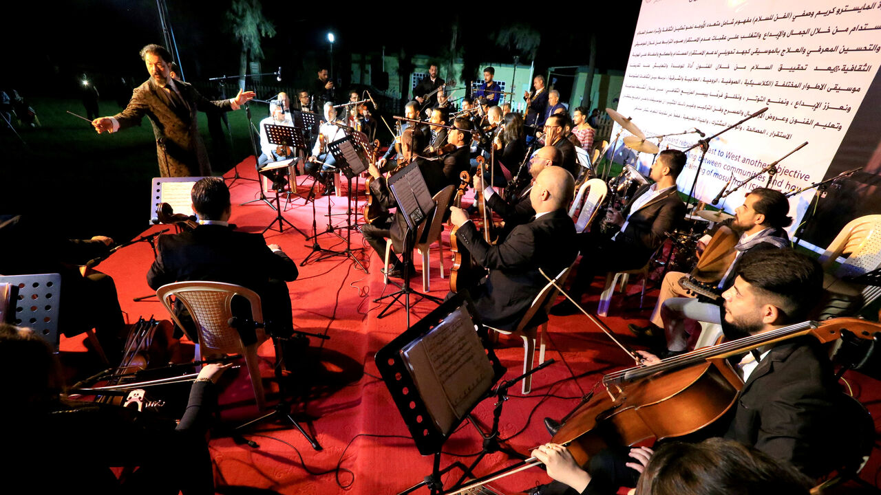 IRAQ-MOSUL/ REFILE - CORRECTING ORCHESTRA NAME Conductor Karim Wasfi leads the Peace Through Arts Farabi Orchestra during a concert in Mosul, Iraq October 27, 2018. Picture taken October 27, 2018. REUTERS/Ari Jalal - RC11765B9AD0