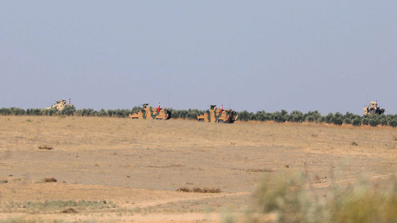 MIDEAST-CRISIS/SYRIA-TURKEY-USA A Turkish flag flutters on a military vehicle on the border of Manbij city, Syria November 1, 2018. REUTERS/Rodi Said - RC1DD5250CE0
