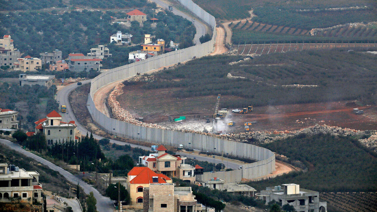 This picture taken on December 4, 2018 near the northern Israeli town of Misgav Am, shows Israeli machinery operating machinery (R) near the border wall with Lebanon. - Israel's army said on December 4 it had detected Hezbollah "attack tunnels" infiltrating its territory from Lebanon and had launched an operation called "Northern Shield" to destroy them, a move likely to raise tensions with the Iran-backed group. (Photo by JALAA MAREY / AFP)        (Photo credit should read JALAA MAREY/AFP/Getty Images)