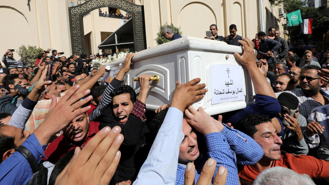 EGYPT-SECURITY/ Mourners carry a coffin during the funeral of Coptic Christians who were killed in an attack, in Minya, Egypt November 3, 2018. REUTERS/Mohamed Abd El Ghany - RC193E912290