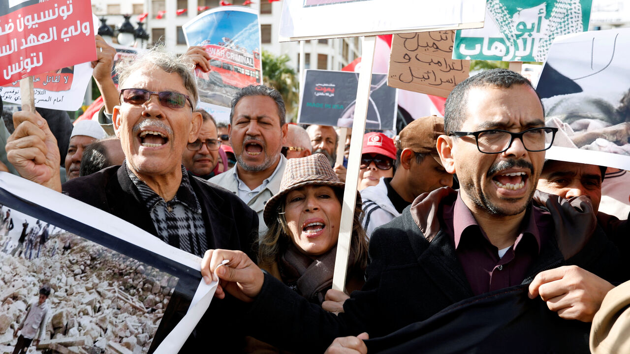 People chant slogans and hold banners as they take part in a protest, opposing the visit of Saudi Arabia's Crown Prince Mohammed bin Salman in Tunis People chant slogans and hold banners as they take part in a protest, opposing the visit of Saudi Arabia's Crown Prince Mohammed bin Salman in Tunis, Tunisia, November 27, 2018. REUTERS/Zoubeir Souissi - RC1CDFF239E0