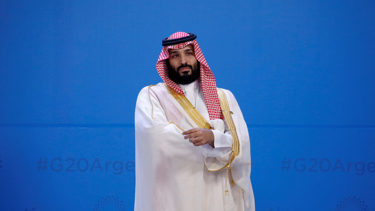 G20-ARGENTINA/LEADERS Saudi Arabia's Crown Prince Mohammed bin Salman waits for the family photo during the G20 summit in Buenos Aires, Argentina November 30, 2018. REUTERS/Andres Martinez Casares/Pool TPX IMAGES OF THE DAY - RC149554C0C0
