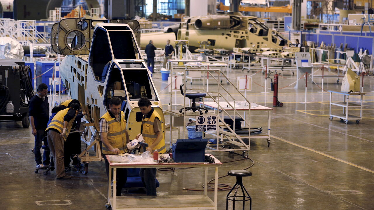 Technicians construct a Turkish Attack and Tactical Reconnaissance Helicopter at the Turkish Aerospace Industries Inc (TAI) factory in Ankara, Turkey Technicians construct a Turkish Attack and Tactical Reconnaissance Helicopter (ATAK) at the Turkish Aerospace Industries Inc (TAI) factory in Ankara, Turkey, April 28, 2015. TAI, which produces F-16 fighter jets and other military aircraft, could float on the Istanbul stock exchange in the second half of this year, its chief executive told Reuters. Ankara-based TAI was established to co-produce Lockheed Martin's F-16 for the Turkish Air Force in 1984. It is almost wholly owned by the Turkish Armed Forces Fo