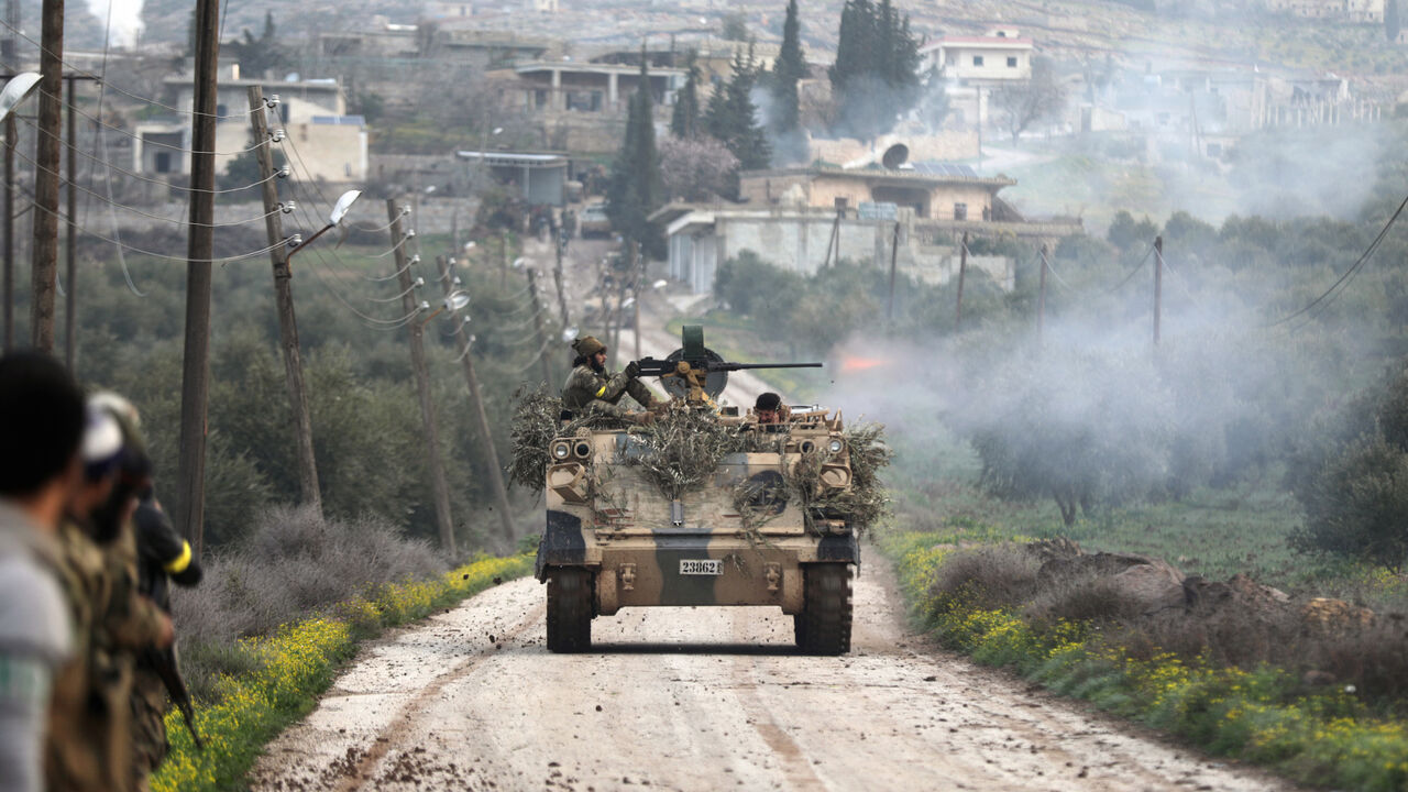 MIDEAST-CRISIS/SYRIA-TURKEY A Turkish-backed Free Syrian Army fighter fires from a tank in Rajo, Syria March 3, 2018. REUTERS/Khalil Ashawi - RC140AB204D0