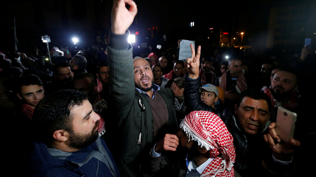 A demonstrator gestures during a protest against the government's tough austerity measures in Amman A demonstrator gestures during a protest against the government's tough austerity measures in Amman, Jordan December 13, 2018. REUTERS/Muhammad Hamed - RC180BF555F0