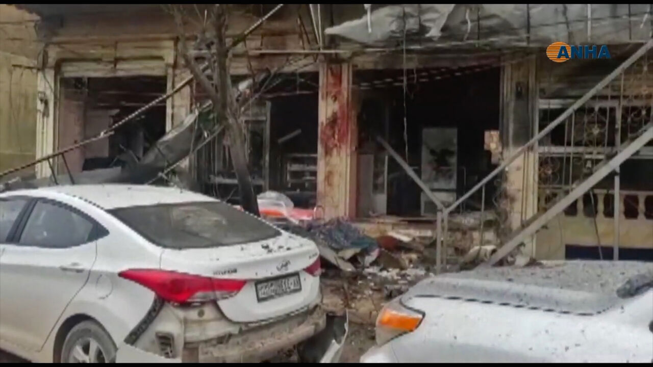 AFP_1CA6N4 An image grab taken from a video published by Hawar News Agency (ANHA) on January 16, 2019, shows the aftermath of a suicide attack in the northern Syrian town of Manbij. - A suicide attack targeting US-led coalition forces in the flashpoint northern Syrian city of Manbij killed a US serviceman and 14 other people today, a monitor said. (Photo by - / various sources / AFP) (Photo credit should read -/AFP/Getty Images)