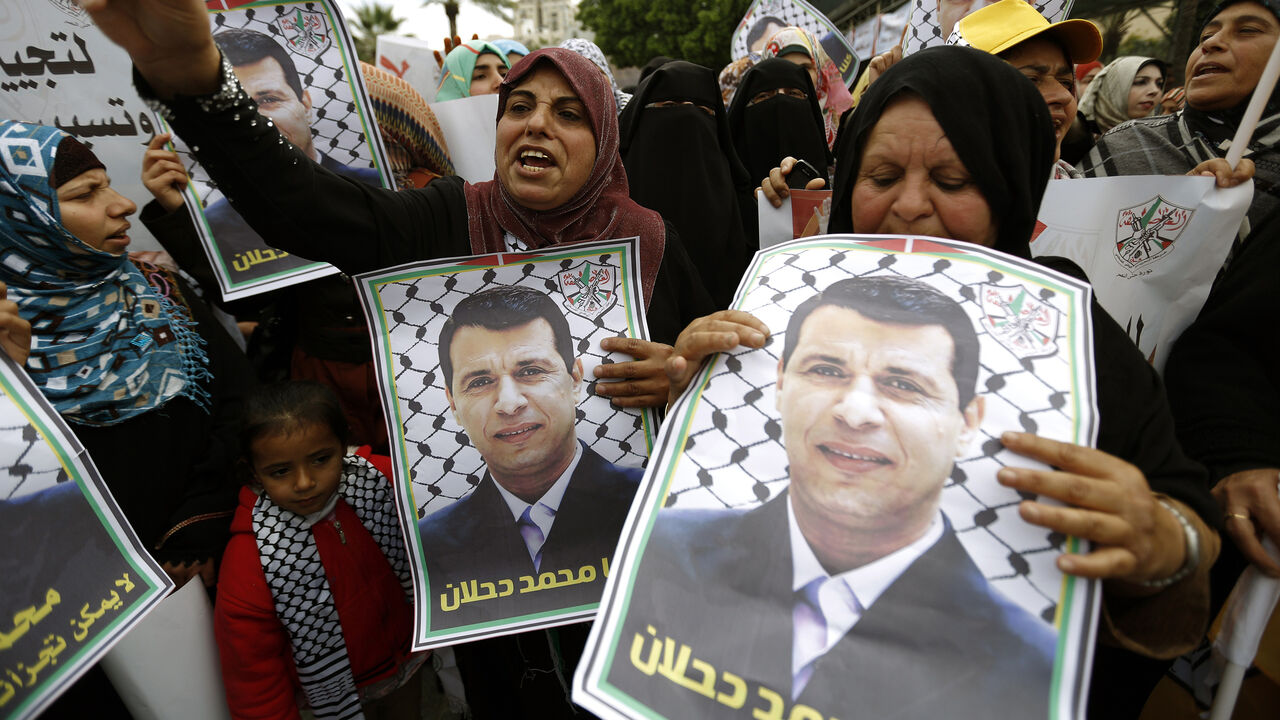 Nic6398310 Palestinian supporters of dismissed senior Fatah leader Mohammed Dahlan shout slogans during a protest to support him on December 18, 2014 in Gaza City. Thousands of supporters of exiled Palestinian strongman Mohammed Dahlan demonstrated in Gaza to protest the reported sacking of dozens of members of the security forces who back him. AFP PHOTO/ MOHAMMED ABED (Photo credit should read MOHAMMED ABED/AFP/Getty Images)