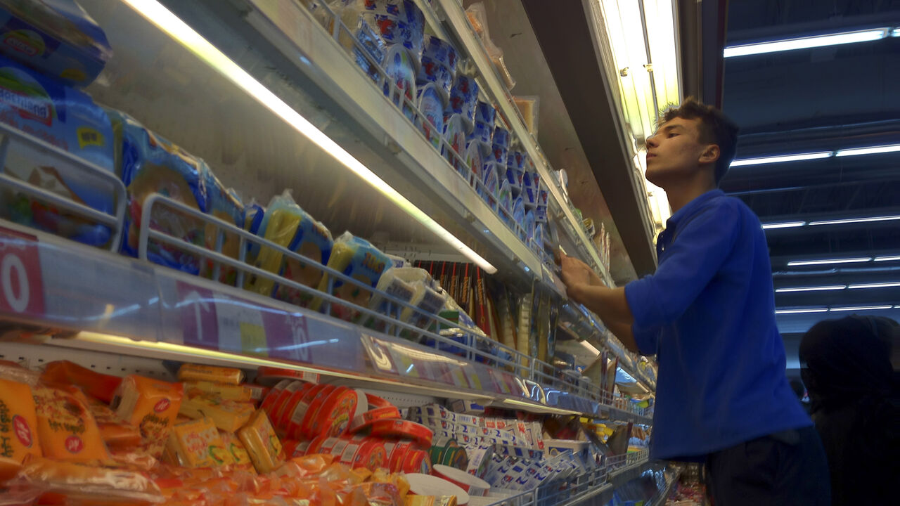 UK-IRAN/MOOD EDITORS' NOTE: Reuters and other foreign media are subject to Iranian restrictions on their ability to film or take pictures in Tehran.
An Iranian employee checks the food shelves at a shopping mall in northwestern Tehran February 3, 2012. With just a month to go before a parliamentary election, Iran has been hit hard in recent months by new U.S. and European economic sanctions over its nuclear programme, which Tehran says is peaceful but the West says is aimed at making a bomb. Picture taken February 3, 2