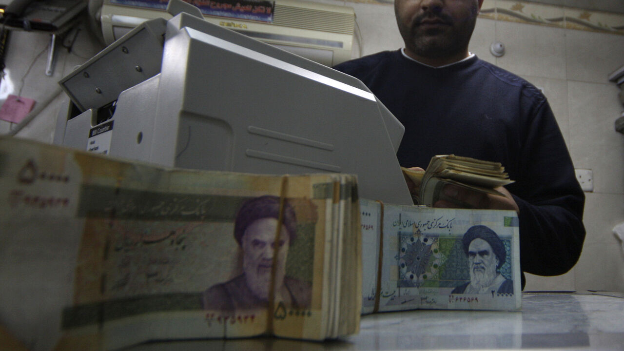 A man counts stacks of Iranian rials at a currency exchange shop in Kerbala A man counts stacks of Iranian rials at a currency exchange shop in Kerbala , 110 km (70 miles) south of Baghdad January 23, 2013. Traders and owners of hotels in the holy city of Kerbala complain of sluggish business and a drop in Iranian pilgrims as a result of a sharp fall in the Iranian rial caused by a package of international sanctions imposed on the neighbouring country. REUTERS/Mushtaq Muhammed (IRAQ - Tags: SOCIETY BUSINESS) - GM1E91N1RPN01