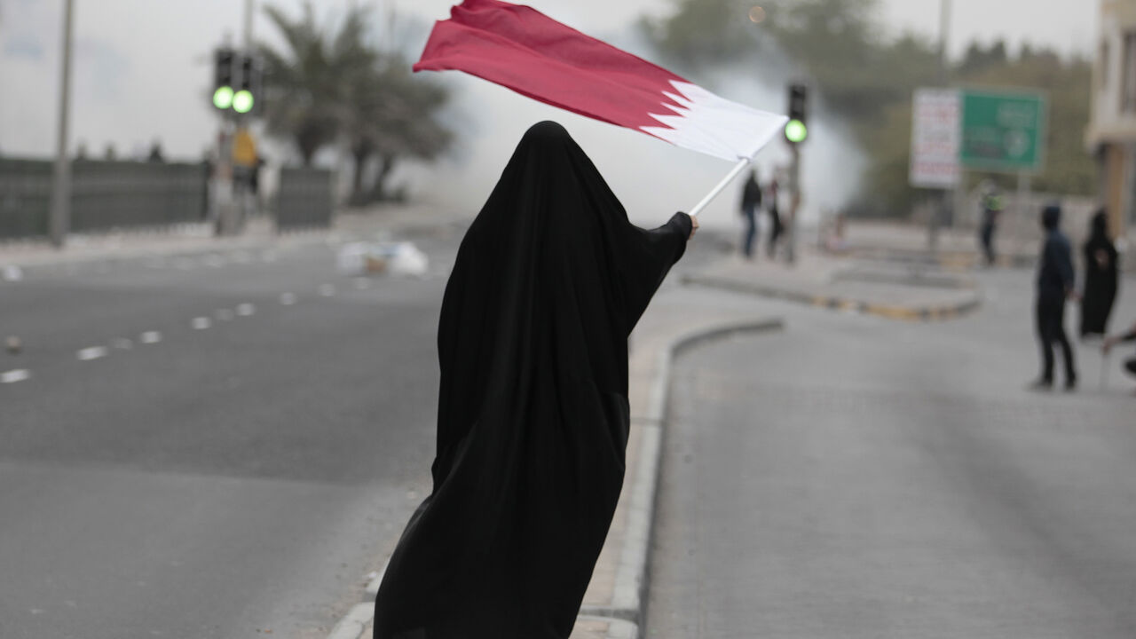 Female protester waves Bahrain's flag as she takes part in a protest marking the 4th anniversary of the 14th February uprising to demand democratic reforms in the village of Sanabis A female protester waves Bahrain's flag as she takes part in a protest marking the 4th anniversary of the 14th February uprising to demand democratic reforms in the village of Sanabis, west of Manama, February 14, 2015.
Bahrain quelled the 2011 uprising but has since struggle to resolve political deadlock between the government and the Shi'ite opposition. Sporadic unrest has continued. REUTERS/Hamad I Mohammed (BAHRAIN - Tags: POLITICS CIVIL UNREST CRIME LAW) - GM1EB2F00KJ01
