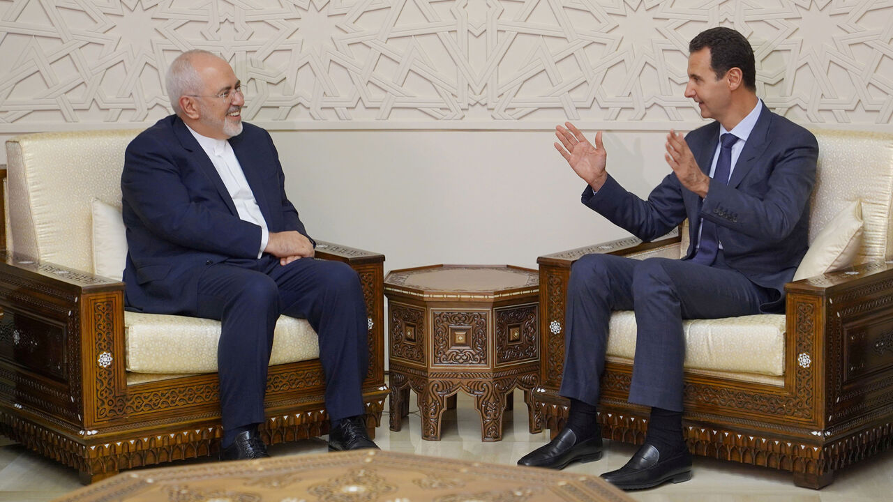 IRAN-SYRIA/ Syrian President Bashar al-Assad meets with Iran's Foreign Minister Mohammad Javad Zarif in Damascus, Syria September 3, 2018. SANA/Handout via REUTERS ATTENTION EDITORS - THIS IMAGE WAS PROVIDED BY A THIRD PARTY. REUTERS IS UNABLE TO INDEPENDENTLY VERIFY THIS IMAGE. - RC1F08842BC0
