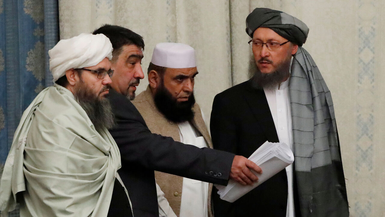 RUSSIA-AFGHANISTAN/ Members of Taliban delegation take their seats during the multilateral peace talks on Afghanistan in Moscow, Russia November 9, 2018. REUTERS/Sergei Karpukhin - RC1BDF87BDC0