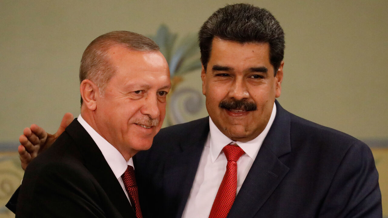 VENEZUELA-TURKEY/ Turkish President Tayyip Erdogan and Venezuela's President Nicolas Maduro attend a news conference after an agreement-signing ceremony between Turkey and Venezuela at Miraflores Palace in Caracas, Venezuela December 3, 2018. REUTERS/Manaure Quintero - RC149F4F7600