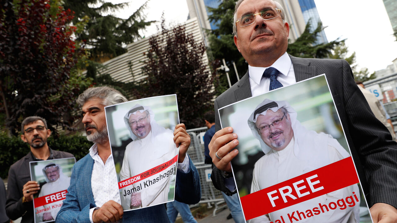 SAUDI-POLITICS/DISSIDENT-PROTEST Human rights activists and friends of Saudi journalist Jamal Khashoggi hold his pictures during a protest outside the Saudi Consulate in Istanbul, Turkey October 8, 2018. REUTERS/Murad Sezer - RC1E12753350