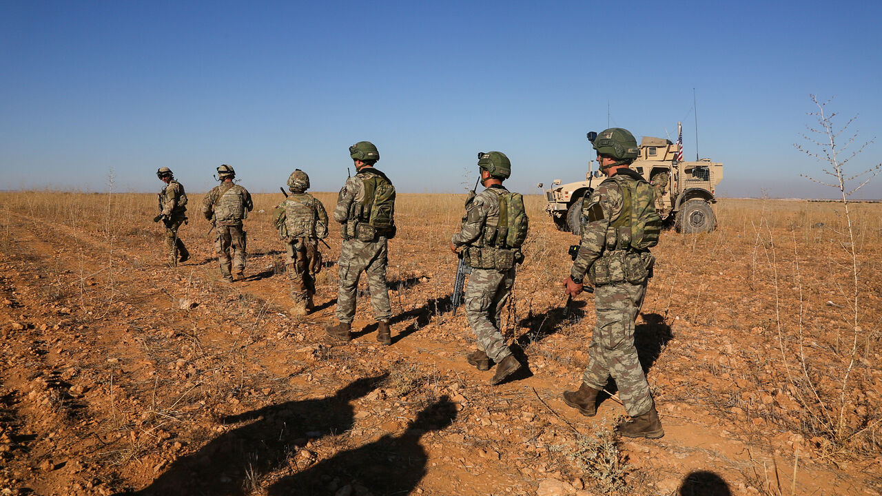 USA-TRUMP/SYRIA U.S. and Turkish soldiers conduct the first-ever combined joint patrol outside Manbij, Syria, November 1, 2018. Picture taken November 1, 2018. Courtesy Arnada Jones/U.S. Army/Handout via REUTERS ATTENTION EDITORS - THIS IMAGE HAS BEEN SUPPLIED BY A THIRD PARTY. - RC17C4EA11D0