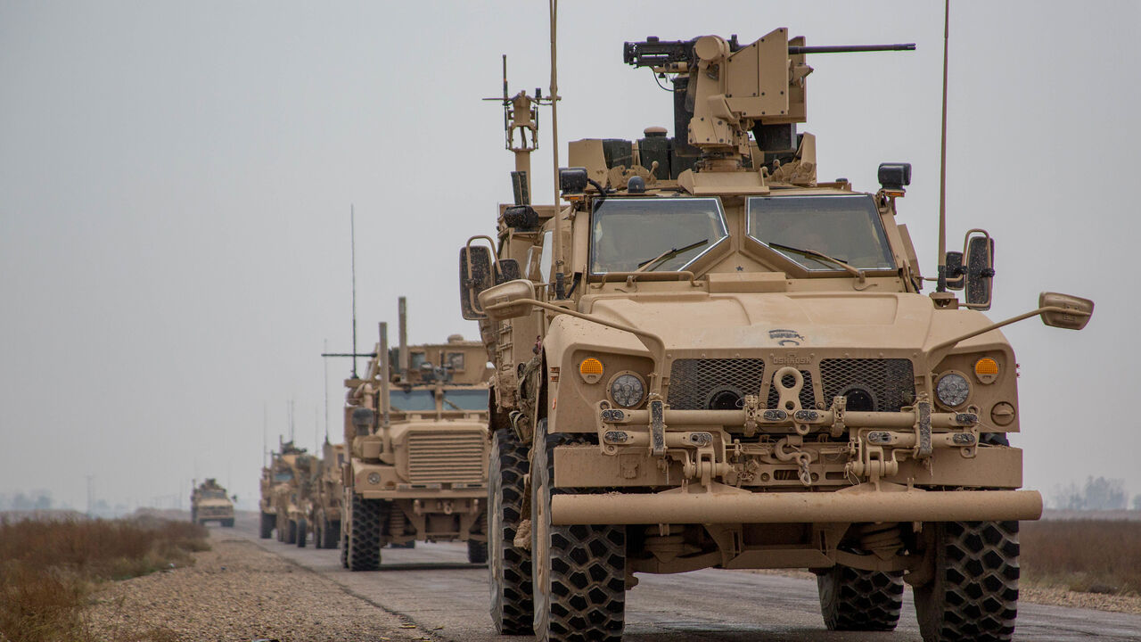 USA-TRUMP/SYRIA A Coalition convoy of U.S. led international coalition against the Islamic State of Iraq and the Levant (ISIL) stops to test fire their M2 machine guns and MK19 grenade launcher in the Middle Euphrates River Valley in the Deir ez-Zor province, Syria, November 22, 2018. Picture taken November 22, 2018. Courtesy Matthew Crane/U.S. Army/Handout via REUTERS ATTENTION EDITORS - THIS IMAGE HAS BEEN SUPPLIED BY A THIRD PARTY. - RC168AA782C0