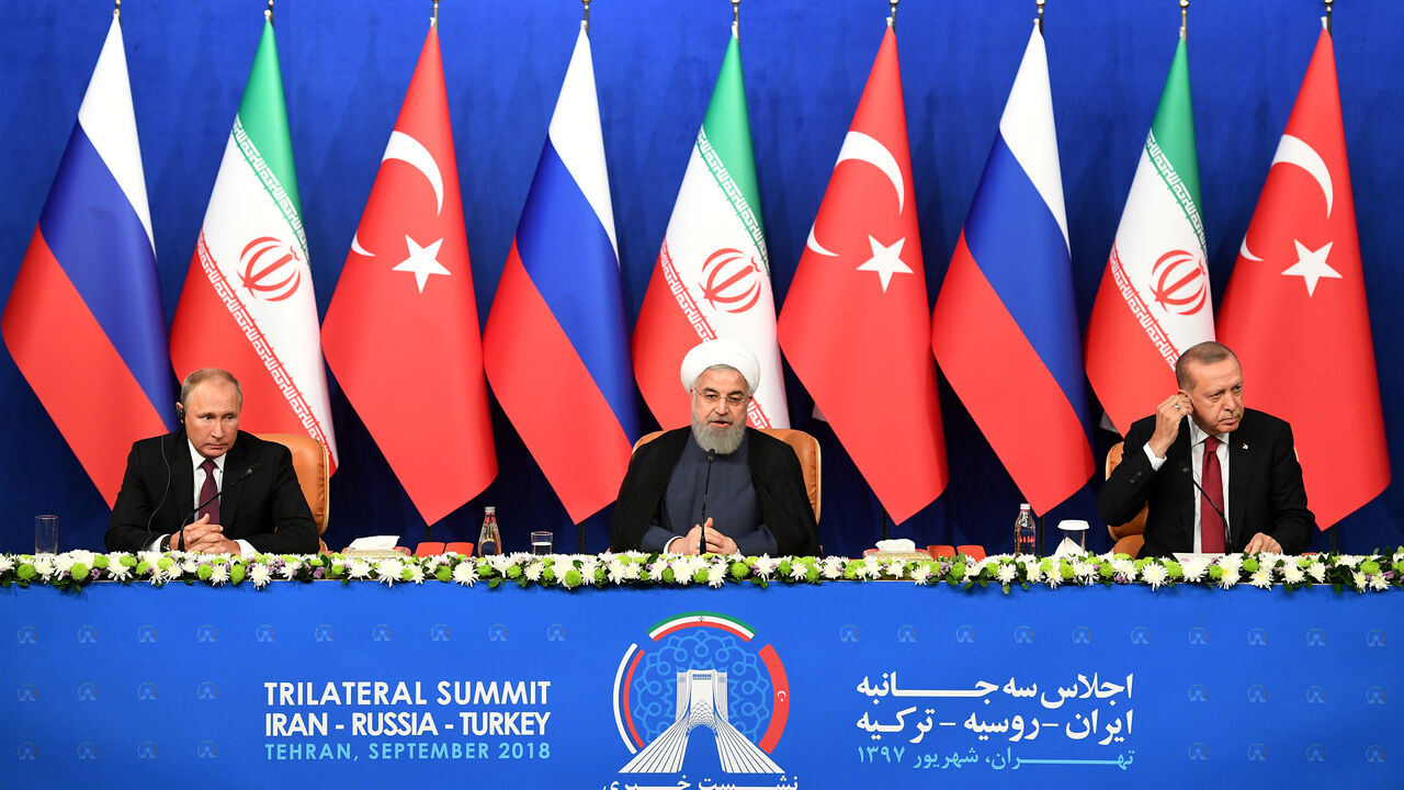 MIDEAST-CRISIS/SYRIA President Vladimir Putin of Russia, Hassan Rouhani of Iran and Tayyip Erdogan of Turkey attend a news conference following their meeting in Tehran, Iran September 7, 2018. Kirill Kudryavtsev/Pool via REUTERS - RC14766DD6C0