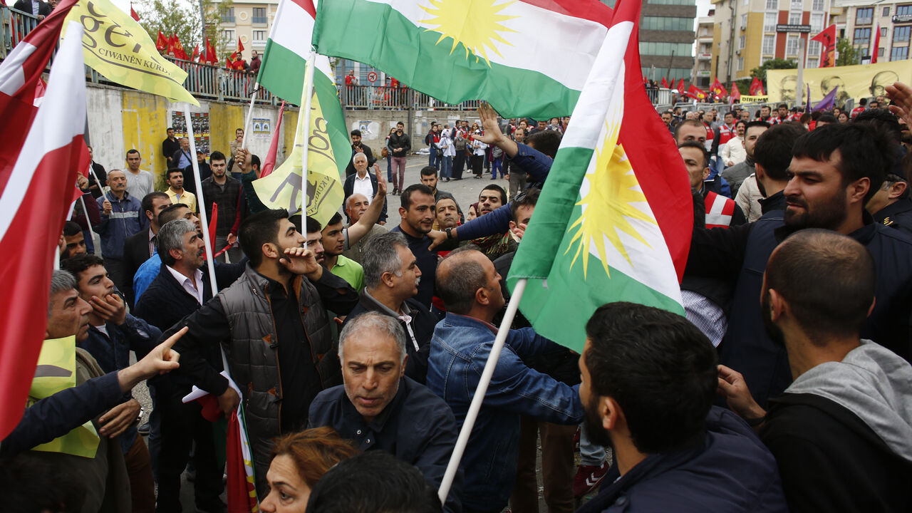 Protestors with flags of Kurdistan scuffle with policemen in plain clothes during a May Day demonstration in Istanbul Protestors with flags of Kurdistan scuffle with policemen in plain clothes during a May Day demonstration in Istanbul, Turkey, May 1, 2016. REUTERS/Murad Sezer - LR1EC510RJ66T
