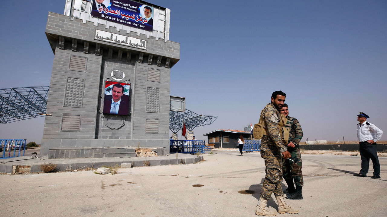 MIDEAST-CRISIS/SYRIA-JORDAN Syrian army soldiers are seen at the Nasib border crossing with Jordan in Deraa, Syria October 15, 2018. REUTERS/Omar Sanadiki - RC153DE05A00