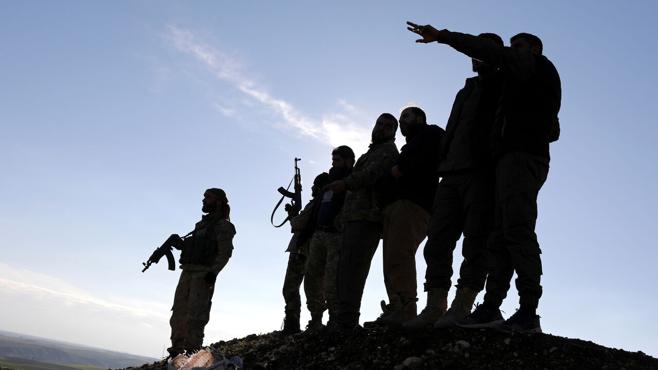 MIDEAST-CRISIS/SYRIA-YPG Turkish-backed Syrian rebels stand with their weapons at Manbij countryside, Syria December 29, 2018. REUTERS/Khalil Ashawi - RC1C44664B70