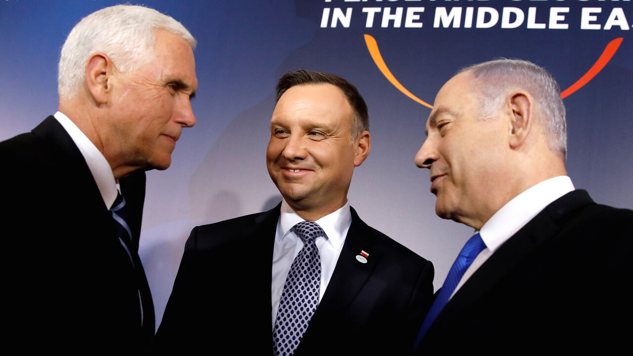 MIDEAST-CRISIS/SUMMIT U.S. Vice President Mike Pence, Polish President Andrzej Duda and Israeli Prime Minister Benjamin Netanyahu talk during the family photo at the Middle East conference at the Royal Castle in Warsaw, Poland, February 13, 2019. REUTERS/Kacper Pempel - RC18F180B8B0