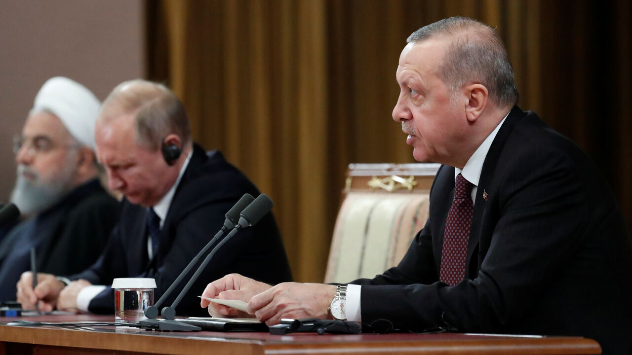 Russian President Vladimir Putin, Iranian President Hassan Rouhani and Turkish President Recep Tayyip Erdogan attend a news conference, after a meeting in the Black sea resort of Sochi Russian President Vladimir Putin, Iranian President Hassan Rouhani and Turkish President Recep Tayyip Erdogan attend a news conference, after a meeting in the Black sea resort of Sochi, Russia, 14 February 2019. Sergei Chirikov/Pool via REUTERS - RC1212462F00