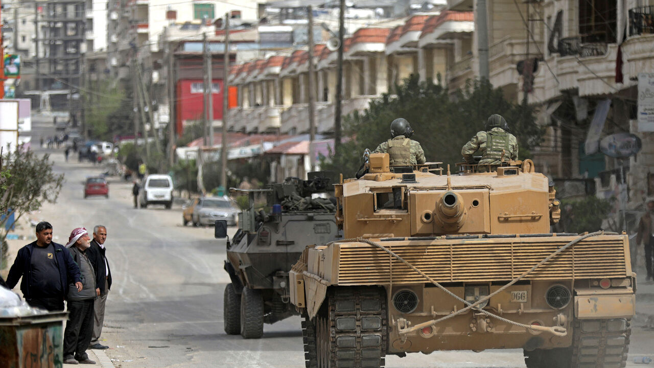 MIDEAST-CRISIS/SYRIA-AFRIN Turkish forces patrol an area in Afrin, Syria March 22, 2018. REUTERS/ Khalil Ashawi - RC19CBF8C260