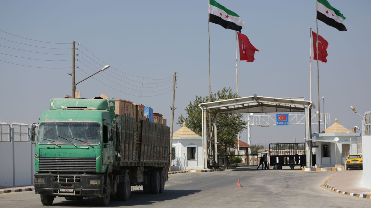 MIDEAST-CRISIS/SYRIA-TURKEY-CURRENCY RTS1Z2XO.jpg