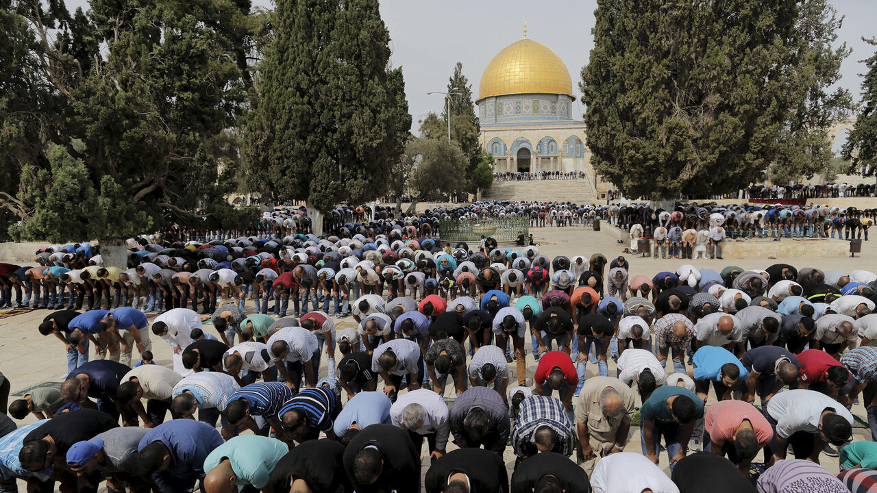 The Dome of the Rock is seen in the background as Palestinian men take part in Friday prayers on the compound known to Muslims as Noble Sanctuary and to Jews as Temple Mount in Jerusalem's Old City October 23, 2015. Palestinian factions called for mass rallies against Israel in the occupied West Bank and East Jerusalem in a "day of rage" on Friday, as world and regional powers pressed on with talks to try to end more than three weeks of bloodshed. Israeli authorities also lifted restrictions on Friday that 