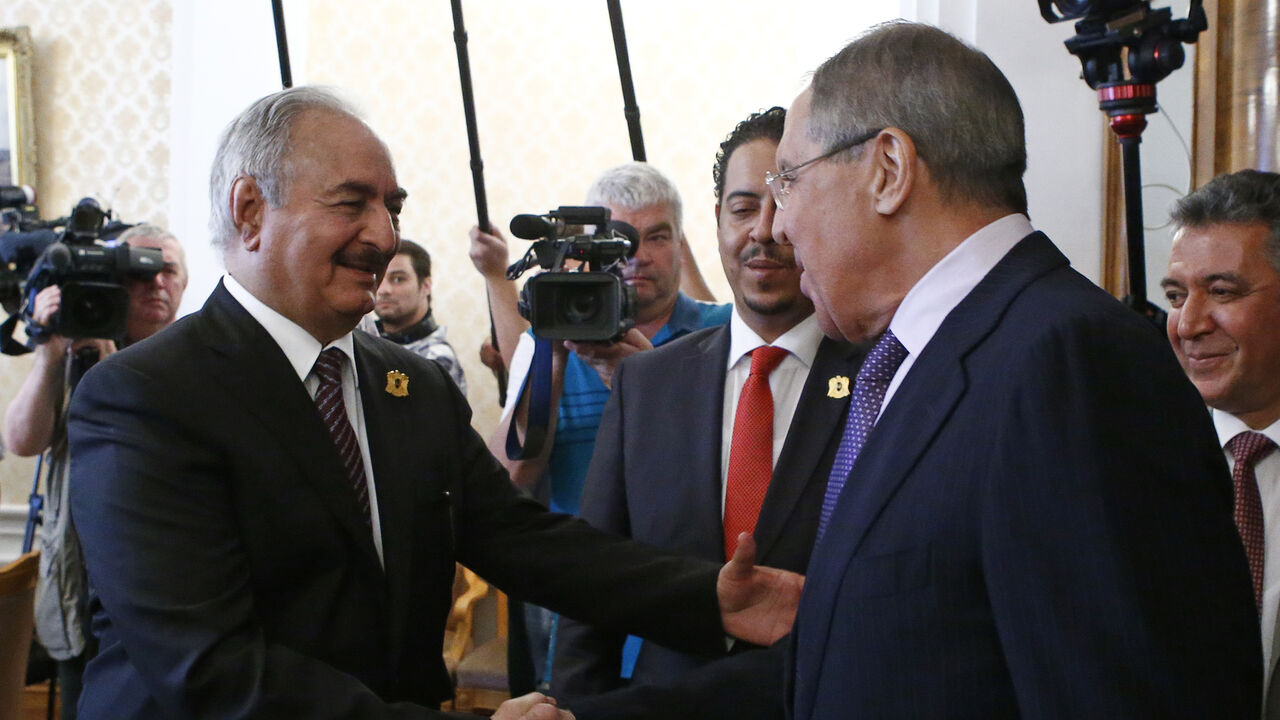 LIBYA-SECURITY/RUSSIA General Khalifa Haftar (L), commander in the Libyan National Army (LNA), shakes hands with Russian Foreign Minister Sergei Lavrov during a meeting in Moscow, Russia August 14, 2017. REUTERS/Sergei Karpukhin - UP1ED8E0PWK6C