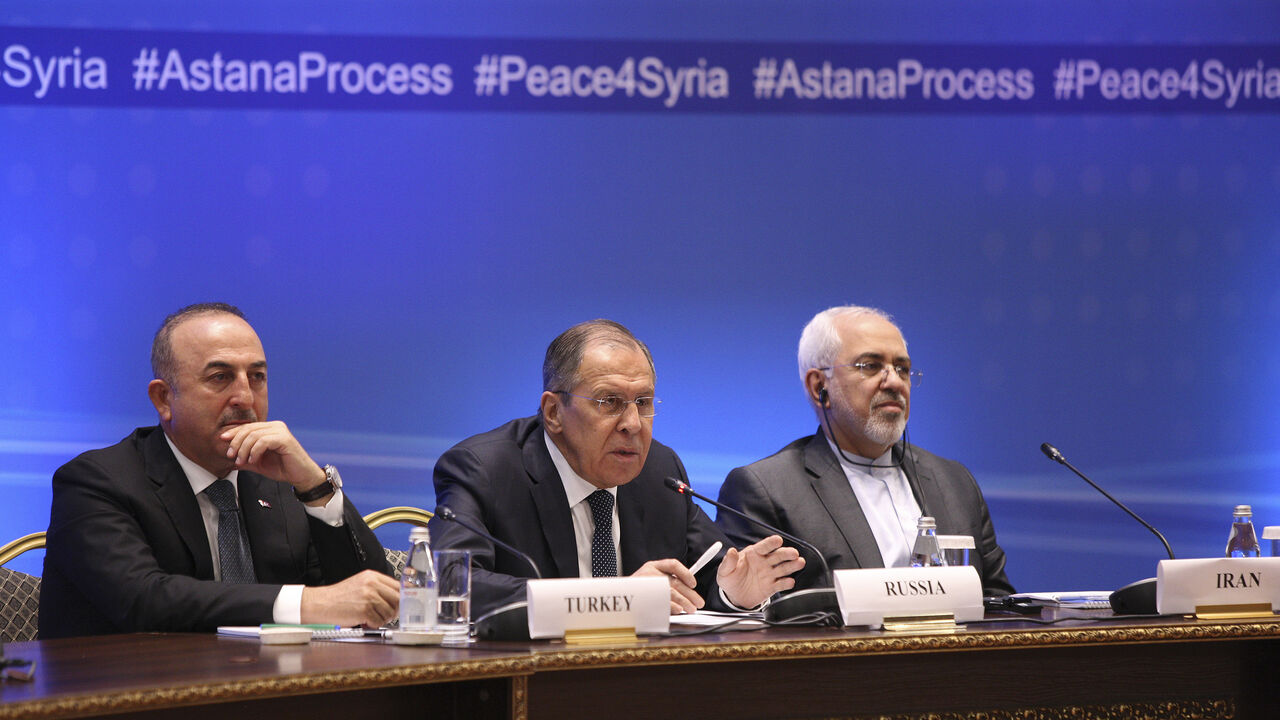 MIDEAST-CRISIS/SYRIA-TALKS Foreign Ministers, Sergei Lavrov (C) of Russia, Mevlut Cavusoglu (L) of Turkey and Mohammad Javad Zarif of Iran, attend the international meeting on Syria in Astana, Kazakhstan March 16, 2018. REUTERS/Mukhtar Kholdorbekov - UP1EE3G0MJ01P