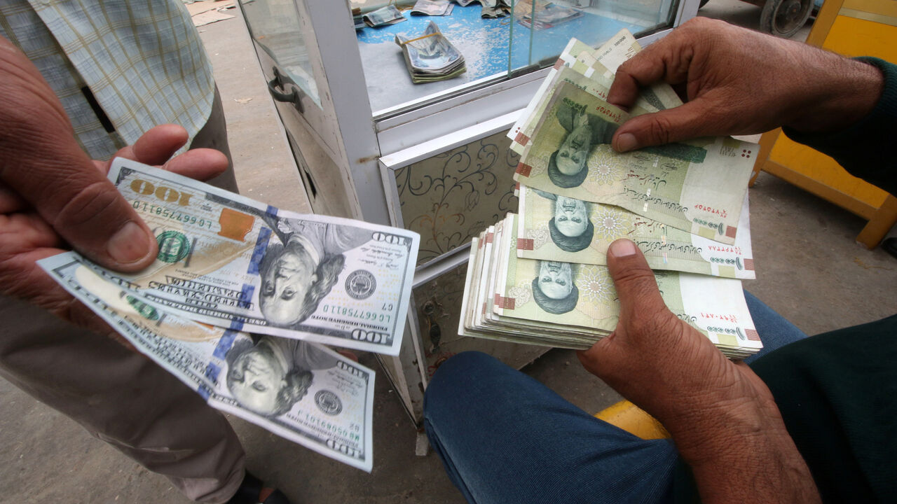 Iranian rials, U.S. dollars and Iraqi dinars are seen at a currency exchange shopÊin Basra Iranian rials, U.S. dollars and Iraqi dinars are seen at a currency exchange shop in Basra, Iraq November 3, 2018. Picture taken November 3, 2018. REUTERS/Essam al-Sudani - RC18BD110300