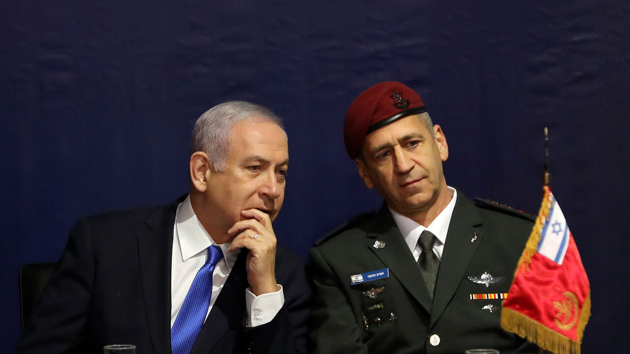 Israeli Prime Minister Benjamin Netanyahu speaks with incoming Israeli Chief of Staff Aviv Kohavi during a ceremony whereby he replaces Lieutenant-General Gadi Eizenkot, at the Defense Ministry in Tel Aviv, Israel Israeli Prime Minister Benjamin Netanyahu speaks with incoming Israeli Chief of Staff Aviv Kohavi during a ceremony whereby he replaces Lieutenant-General Gadi Eizenkot, at the Defense Ministry in Tel Aviv, Israel January 15, 2019. REUTERS/Corinna Kern - RC116DA9AC60